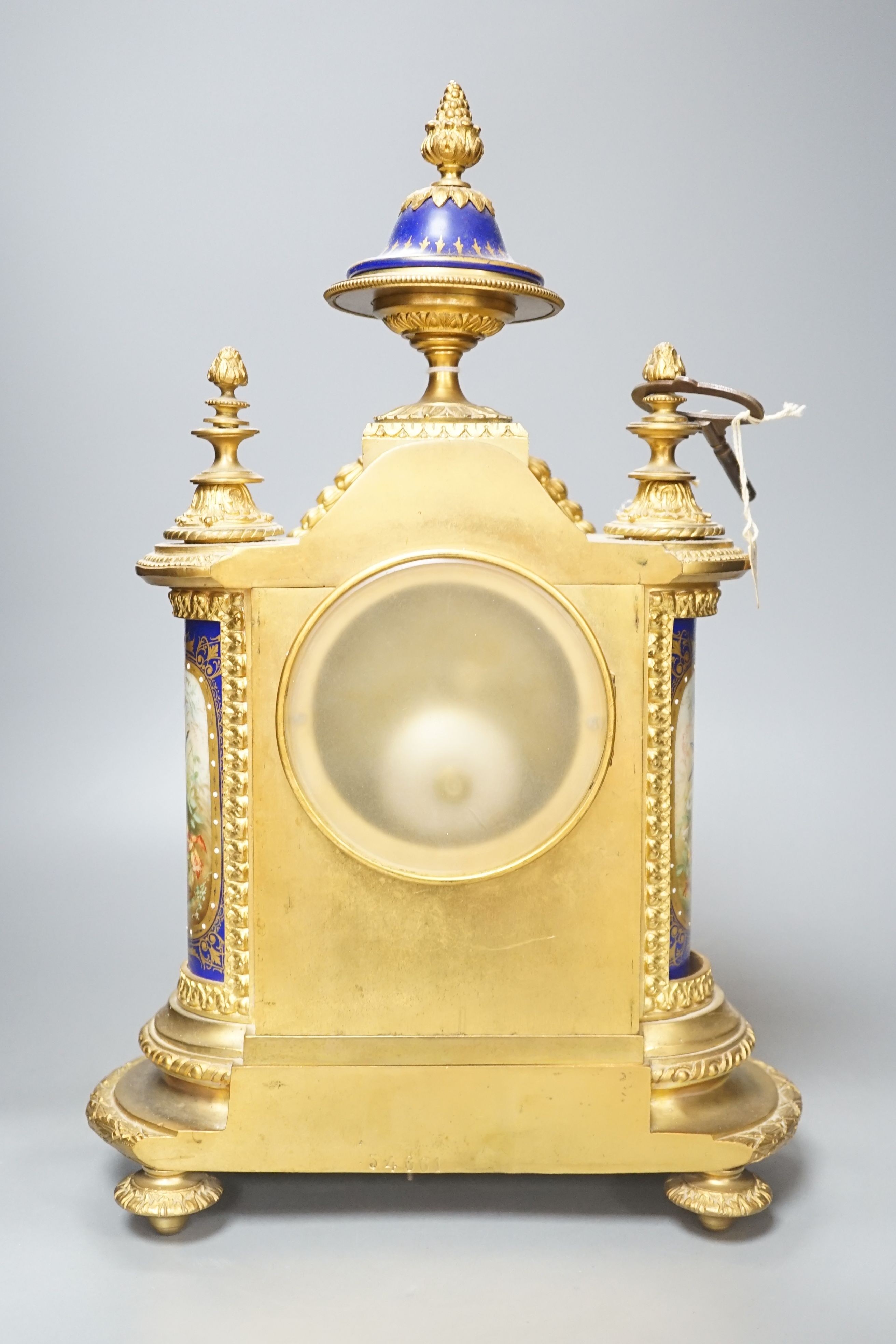 A 19th century French ormolu cased mantel clock, with decorated porcelain panels and face, eight day movement with strike, 40cm high